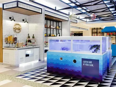 a shop with a fish tank in a room at ibis Styles Manila Araneta City in Manila