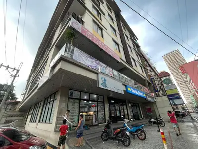 a group of people standing in front of a building at Nature Inspired Cozy Studio Rooms Mandaluyong Near Edsa Shaw Shangri-La Megamall at F Residences in Manila