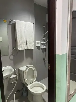 a small bathroom with a toilet and a sink at Nature Inspired Cozy Studio Rooms Mandaluyong Near Edsa Shaw Shangri-La Megamall at F Residences in Manila