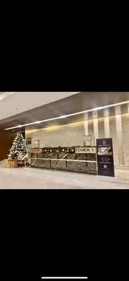 a shopping mall with a christmas tree in the background at Apartment Seaside Bliss in Manila