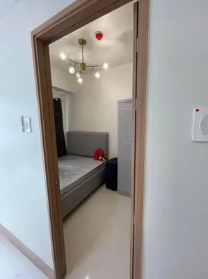 a mirror reflection of a bedroom with a bed at Mall of Asia Shore 3 near Airport Pasay Manila 1 Bedroom Wifi in Manila