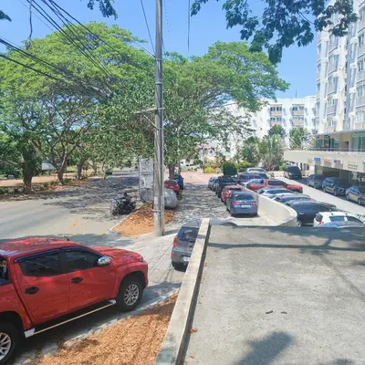 a red car parked on the side of a street at Condo in Silang near Nuvali - Dy's Haven Suites in Silang