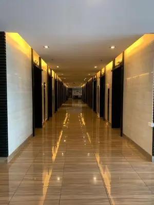 an empty hallway of a building with a long corridor at TOP RATED 2026 Traveler Award Air Residences Manila Makati City Comfort and Style Budget Friendly Top rated prime location very short ride to and from airport in Manila