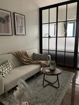 a living room with a couch and a table at TOP RATED 2026 Traveler Award Air Residences Manila Makati City Comfort and Style Budget Friendly Top rated prime location very short ride to and from airport in Manila