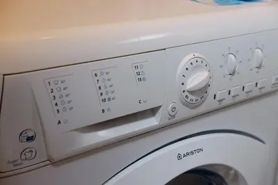 a close up of a washing machine at Thompson Suites Queen Room, One Uptown Residences, XBOX & Netflix in Manila