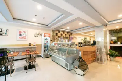 a restaurant with a store with a food court at AMORE HOTEL MANILA in Manila