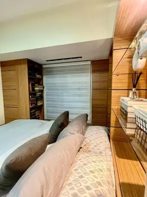 a bedroom with a bed with two pillows on it at PSV NAIA T3 - Month of January - New Year 2026 PROMO Php 1,999 - 1 BR Interior Designed Unit in Manila
