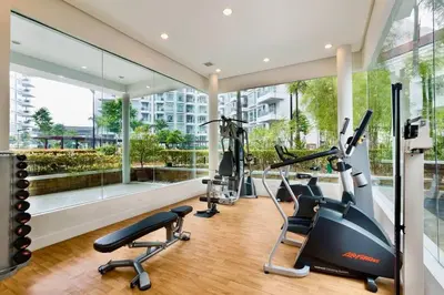 a gym with treadmills and ellipticals in a building at PSV NAIA T3 - Month of January - New Year 2026 PROMO Php 1,999 - 1 BR Interior Designed Unit in Manila