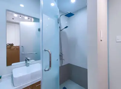 a bathroom with a sink and a shower at 1BR Condotel Suite at Sunshine100 City Plaza #SS01 in Manila