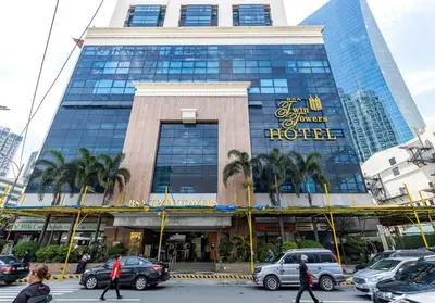 a hotel building with cars parked in front of it at Executive Suite - BSA Twin Towers, Ortigas Ctr in Manila