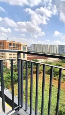 a balcony with a view of some buildings at Scandi-Style & Organic condo Shore 3 MOA in Manila