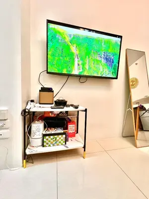a flat screen tv hanging on a wall at Mandaluyong Staycation in Manila