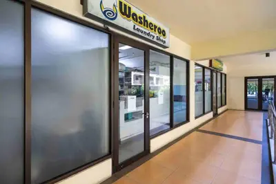 a store front with sliding glass doors at Penthouse Condo Unit near Airport NAIA in Manila