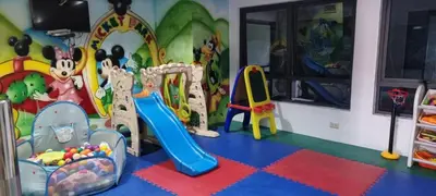 a childs play room with toys and a slide at ADB AVENUE TOWER in Manila