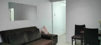 a living room with a couch and a mirror at Staycation at Azure Urban Resorts in Manila