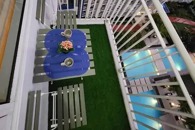 an overhead view of a blue table and chairs on a balcony at Great View in Makati in Manila
