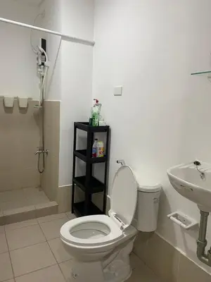 a bathroom with a toilet and a sink at Studio Type Condominum at SMDC HOPE Residences in Trece Martires