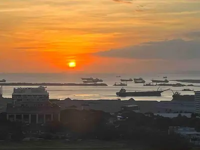 a group of boats in the water at sunset at Coast of Finland: Stunning Manila Bay & Sunset in Manila