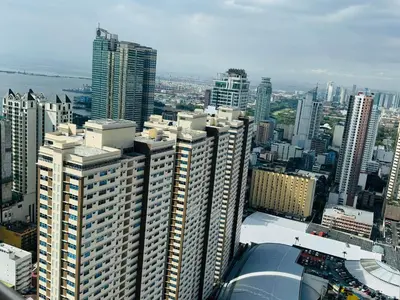 a view of a large city with tall buildings at Birch Tower a2 Front of Robinson Mall in Manila