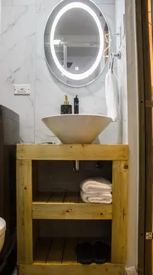 a bathroom with a white sink and a mirror at RQ Cozy One Bedroom Condo, Coast Residences Pasay in Manila