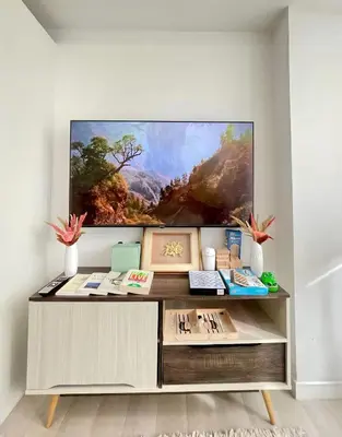 a large flat screen tv on a wall at A3J Staycation at Azure Urban Resort Residences in Manila