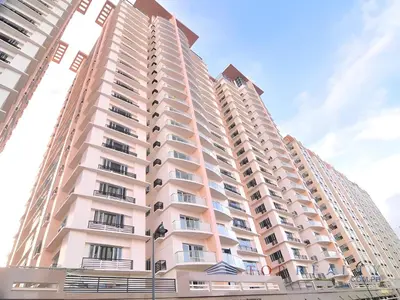 a tall building with balconies on the side of it at Cozy & Airy Suite near Venice Mall FREE Pool & Gym in Manila