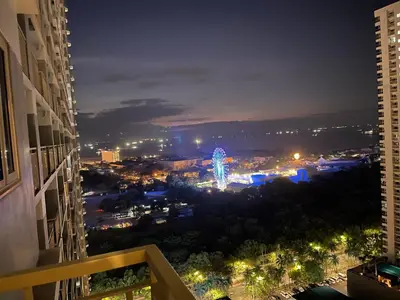 a view of a city lit up at night at SMDC Coast Residences in Manila