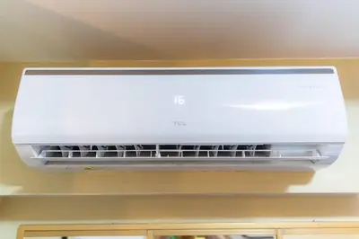 a white air conditioner hanging from a ceiling at A2J BGC Luxury 2BR Loft Near High Street, Airport in Manila