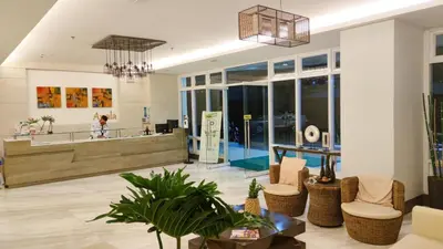 a lobby of a store with chairs and a counter at Anuva Stays in Manila