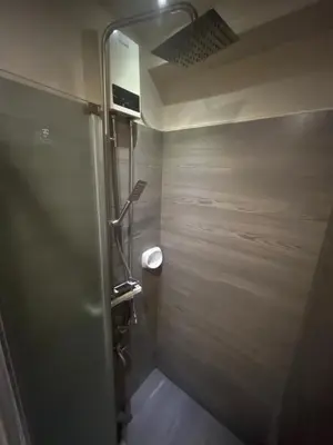 a bathroom with a shower stall with a toilet at WHT Pod in Punta