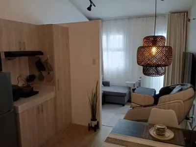 a living room with a couch and a table at WHT Pod in Punta