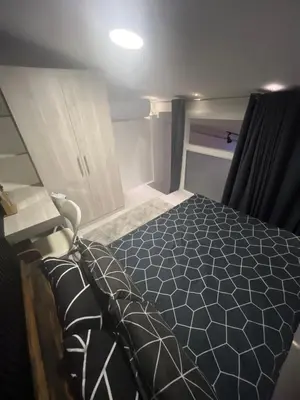 a bedroom with a bed in a small room at WHT Pod in Punta