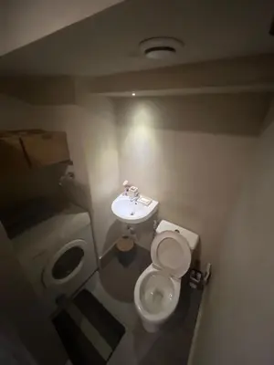a small bathroom with a toilet and a sink at WHT Pod in Punta