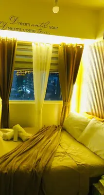 a bedroom with a bed with curtains and a window at Not active listing in Manila