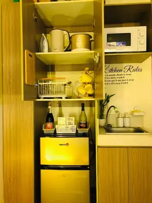 a kitchen with a yellow refrigerator and a sink at Not active listing in Manila