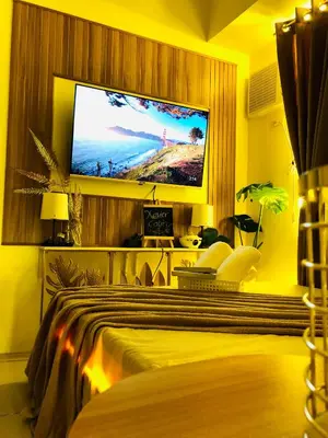a bedroom with a flat screen tv on the wall at Not active listing in Manila