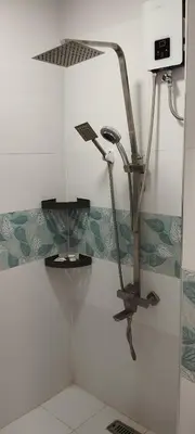a shower in a bathroom with a glass wall at 15 Guest - Unit 1&2 House type and Studio type in Pasong Mannga