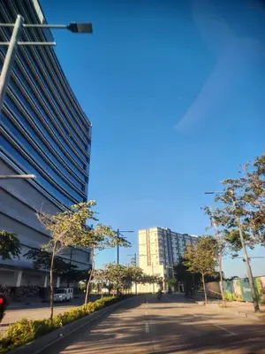 a street in front of a tall building at Le Palis Suite in Bukal