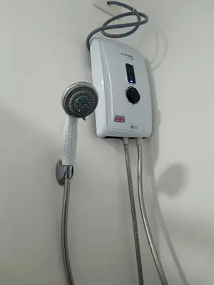a blow dryer is plugged into a wall at Happy Stays C - 300mbps - 65