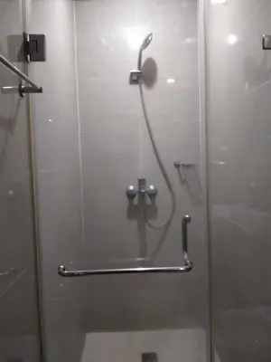 a shower in a bathroom with a glass door at RG condotel Near Naia Terminal 3 in Manila