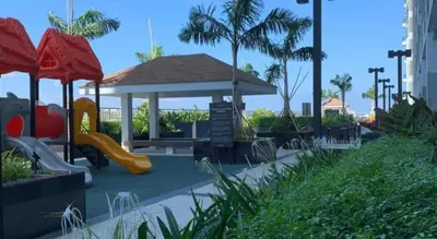 a playground with a slide and a gazebo at Manila Bay Retreat at Soleil Suite in Manila