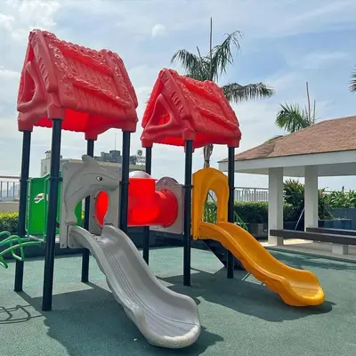 a playground with two slides at Manila Bay Retreat at Soleil Suite in Manila