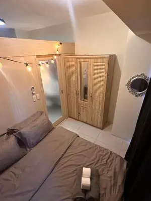 a bedroom with a large bed in a room at Makati SM Jazz Residence Staycation Condo with balcony in Manila
