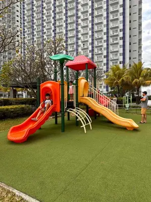 a playground with two slides and a slideintend at Makati SM Jazz Residence Staycation Condo with balcony in Manila