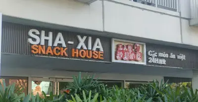 a sha xia snack house sign on a building at Sea Residences-Reisha in Manila