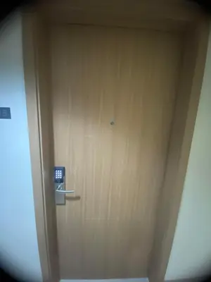 a wooden door with a sign on it at Ella’s Condo@Shore3 T3 in Manila