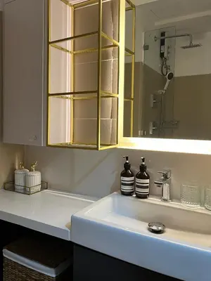 a bathroom with a sink with a mirror and a sink at New Luxury Condo in Mall of Asia and near Manila Airport in Manila