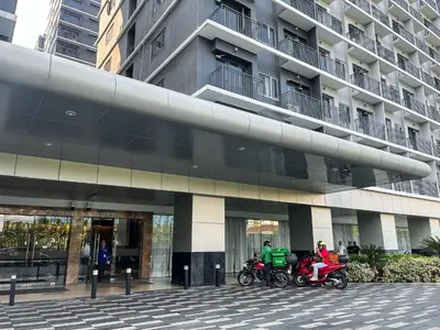 two motorcycles parked in front of a building at New Luxury Condo in Mall of Asia and near Manila Airport in Manila