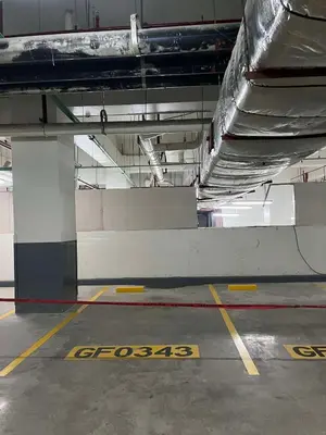 a parking lot in a building with at New Luxury Condo in Mall of Asia and near Manila Airport in Manila