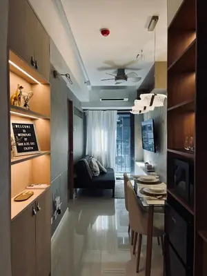 a kitchen and dining room with a table and a couch at New Luxury Condo in Mall of Asia and near Manila Airport in Manila